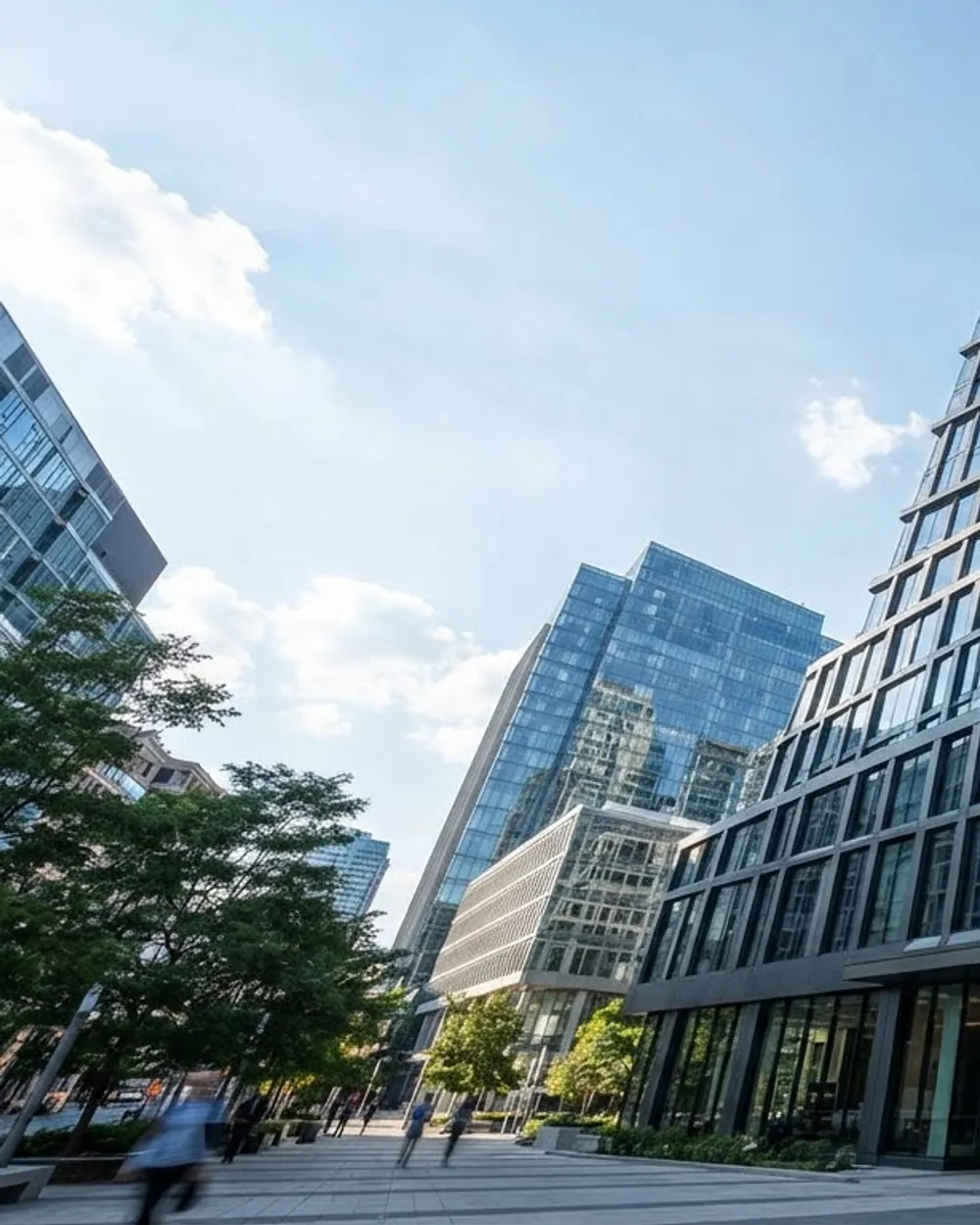 Commercial elevation mixing reflective glazing with flat composite cladding panels.
